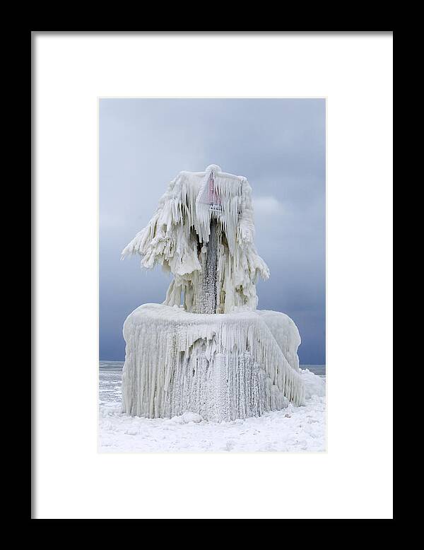 Lighthouse Framed Print featuring the photograph Ice Covered Warning Tower along Lake Michigan in St. Joseph Michigan by Peter Ciro