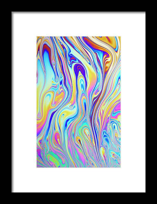 Water Framed Print featuring the photograph Interference Pattern Of Oil On Water by Lawrence Lawry