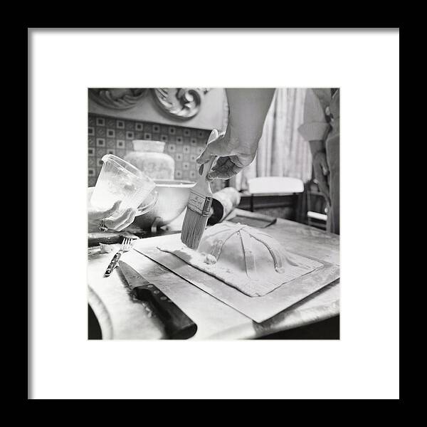 Indoors Framed Print featuring the photograph James Beard Basting Pastry by Ernst Beadle