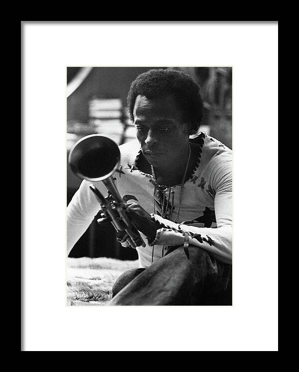 Artist Framed Print featuring the photograph Jazz Musician Miles Davis Looking At His Trumpet by Mark Patiky