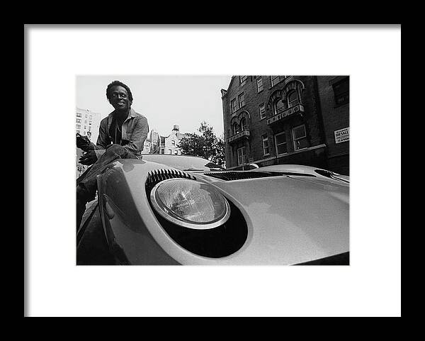 Music Framed Print featuring the photograph Jazz Musician Miles Davis Sitting On The Hood by Mark Patiky