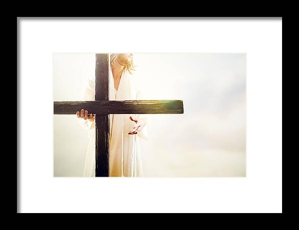 People Framed Print featuring the photograph Jesus Christ Holding Cross by RyanJLane