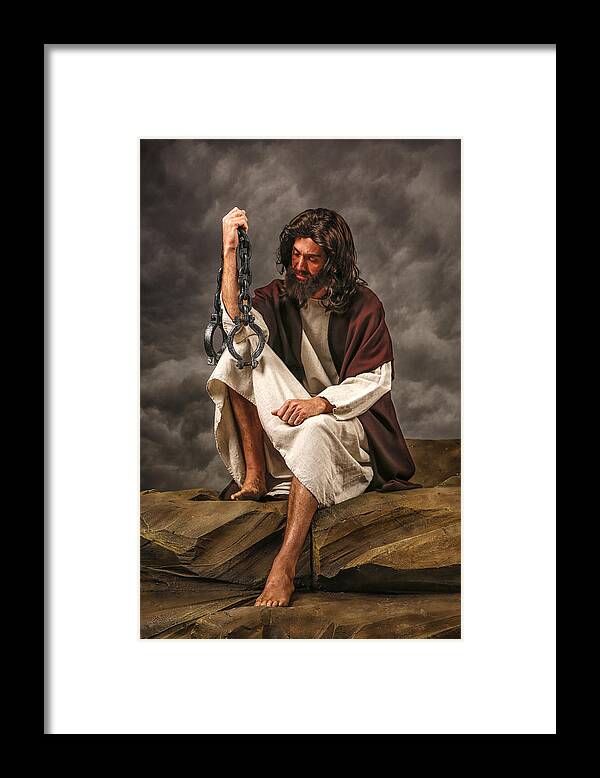 Allah Framed Print featuring the photograph Jesus Sitting on rock holding chains by Inhauscreative