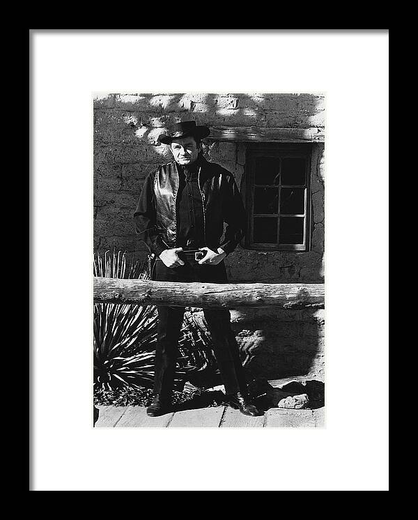 Johnny Cash Gunslinger Hitching Post Old Tucson Az Black And White Framed Print featuring the photograph Johnny Cash gunslinger hitching post Old Tucson Arizona 1971 by David Lee Guss