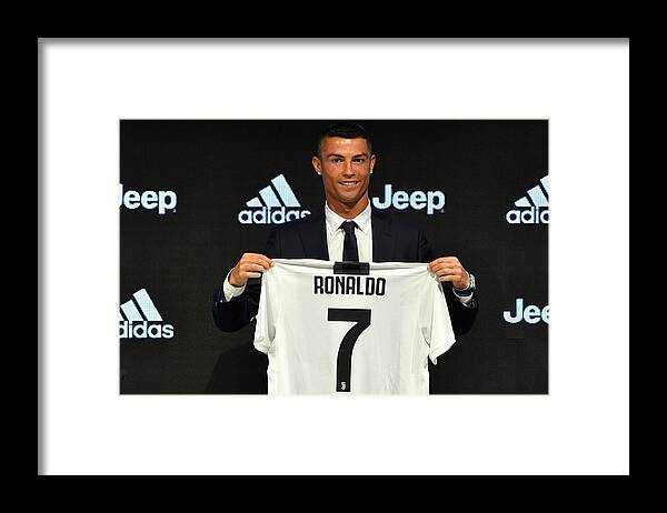 New Signing Framed Print featuring the photograph Juventus - Cristiano Ronaldo Day by Valerio Pennicino - Juventus FC