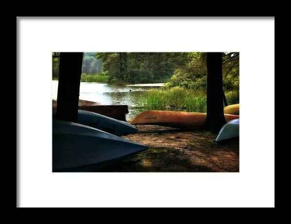 Kayak Framed Print featuring the photograph Kayaks on the Shore by Michelle Calkins