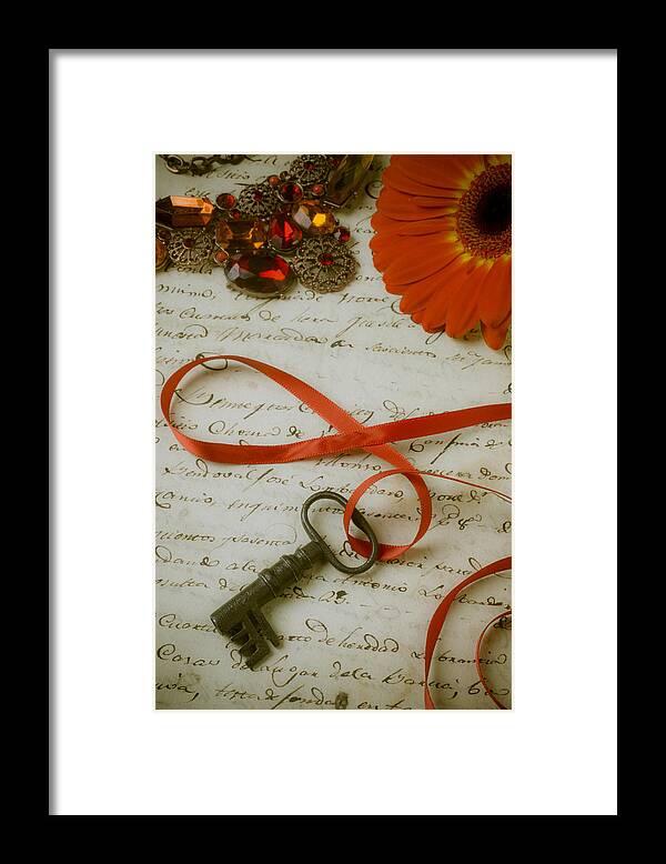 Key Framed Print featuring the photograph Key on red ribbon by Garry Gay