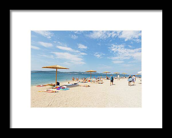 Water's Edge Framed Print featuring the photograph Kolovare Beach In Zadar, Croatia by Marcos Welsh