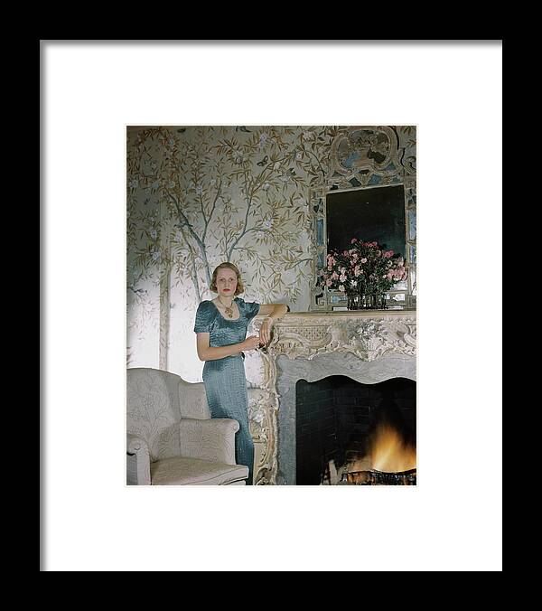 Eye Contact Framed Print featuring the photograph Laura Elizabeth Curtis By A Fireplace by Horst P. Horst