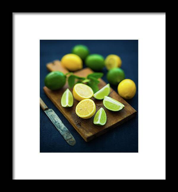 Orange Color Framed Print featuring the photograph Lemons And Limes by Thepalmer