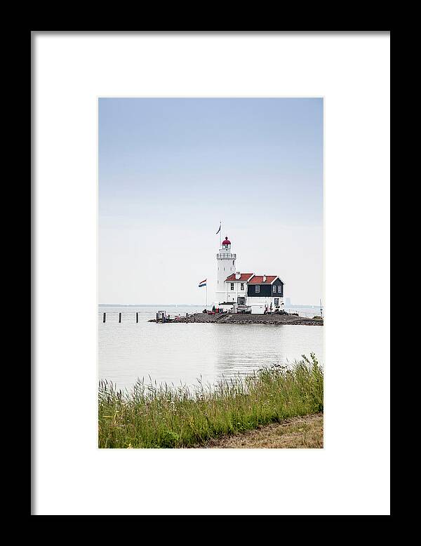 Tranquility Framed Print featuring the photograph Lighthouse On The Netherlands Coast by Buena Vista Images
