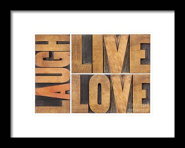 Abstract Framed Print featuring the photograph Live Love And Laugh In Wood Type by Marek Uliasz