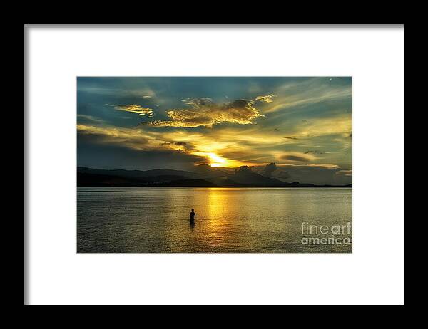 Michelle Meenawong Framed Print featuring the photograph Lonely Fisherman by Michelle Meenawong