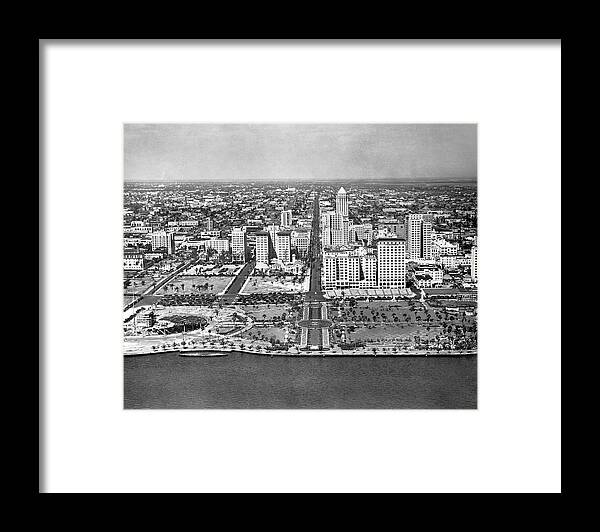 1920s Framed Print featuring the photograph Looking up Flagler Street at downtown Miami by Underwood Archives