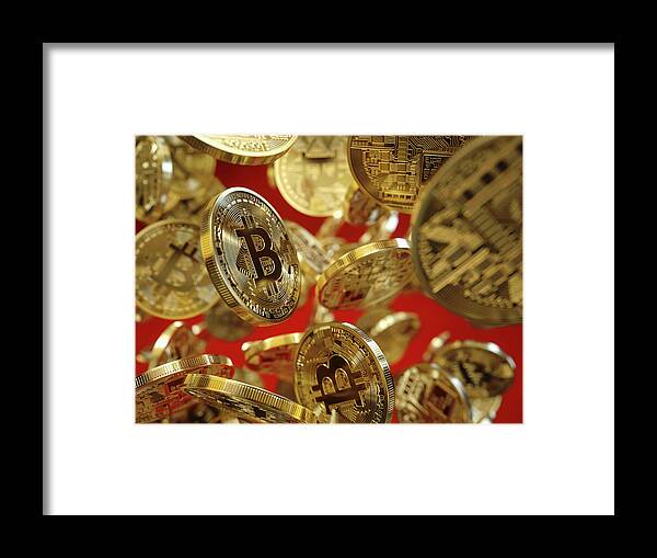 Abundance Framed Print featuring the photograph Lots Of Shiny New Gold Bitcoins Falling by Ikon Ikon Images