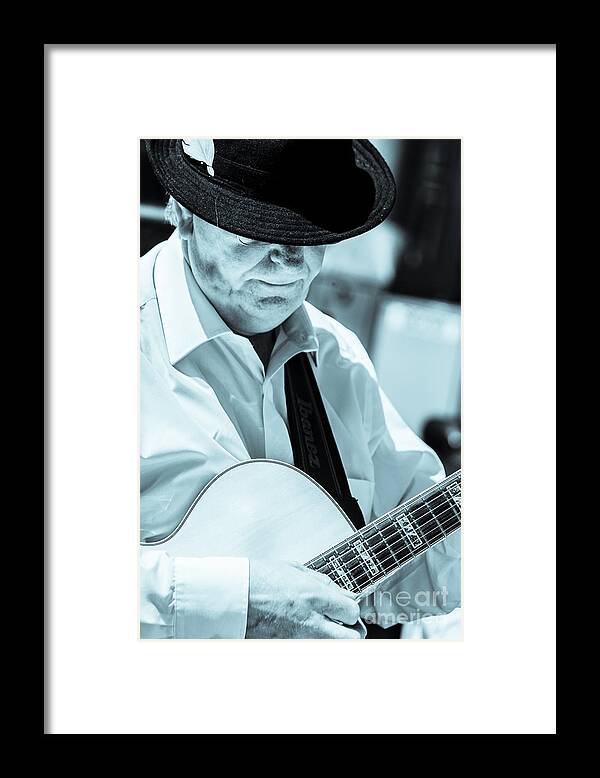 Music Instrument Framed Print featuring the photograph Male In Alpine Hat Playing Guitar by Peter Noyce