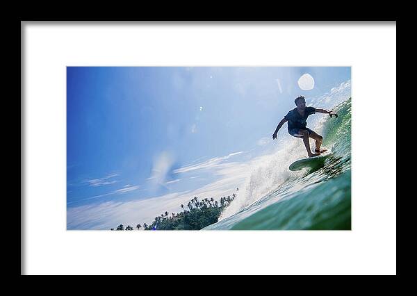Expertise Framed Print featuring the photograph Man Surfs Waves On Sunlit Sea, Palm by Ascent Xmedia