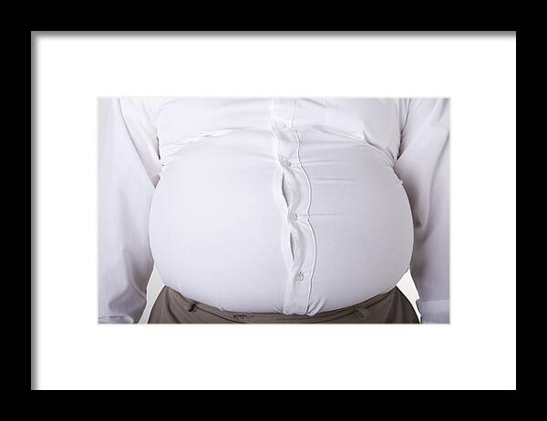 Too Small Framed Print featuring the photograph Man with enlarged stomach, too small shirt, mid section, close-up by David Zaitz