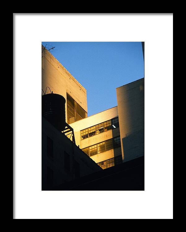 Manhattan Framed Print featuring the photograph Manhattan Rooftop Sunlight and Shade by Gordon James