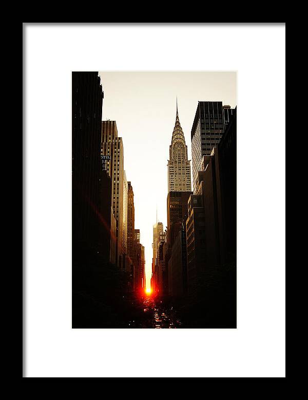 New York City Framed Print featuring the photograph Manhattanhenge Sunset and the Chrysler Building by Vivienne Gucwa