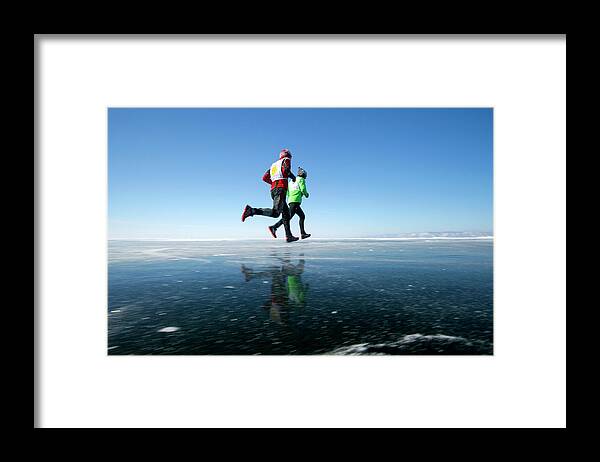 Baikal Ice Marathon Framed Print featuring the photograph Marathon Runners by Louise Murray