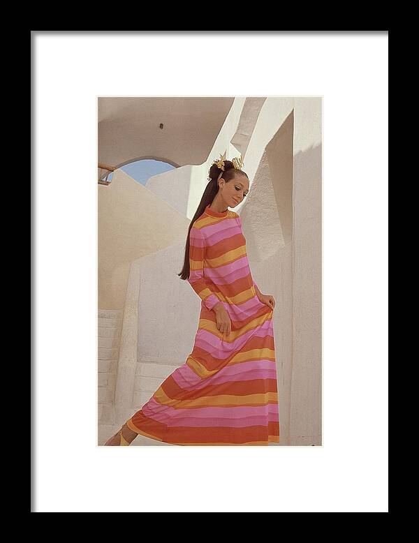 Fashion Framed Print featuring the photograph Marisa Berenson In A Bright Striped Dress by Henry Clarke
