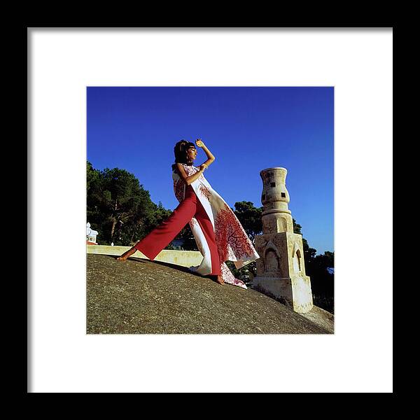 Fashion Framed Print featuring the photograph Marisa Berenson Wearing A Valentino Ensemble by Arnaud de Rosnay