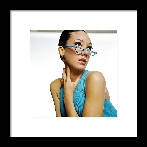 Accessories Framed Print featuring the photograph Marisa Berenson Wearing Blue Glasses by Bert Stern