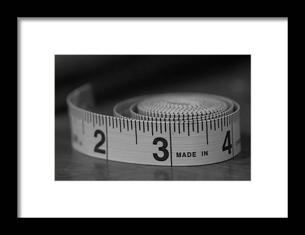 Tape Measure Framed Print featuring the photograph Measuring Up by Holden The Moment