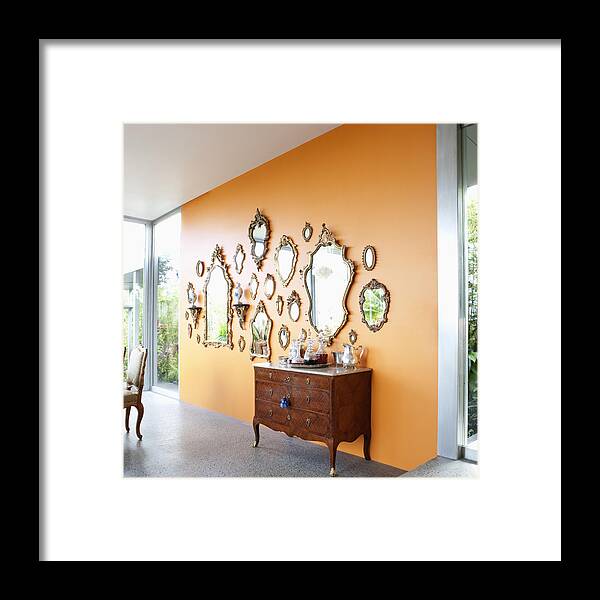 Hanging Framed Print featuring the photograph Mirrors on orange wall by Robert Nicholas