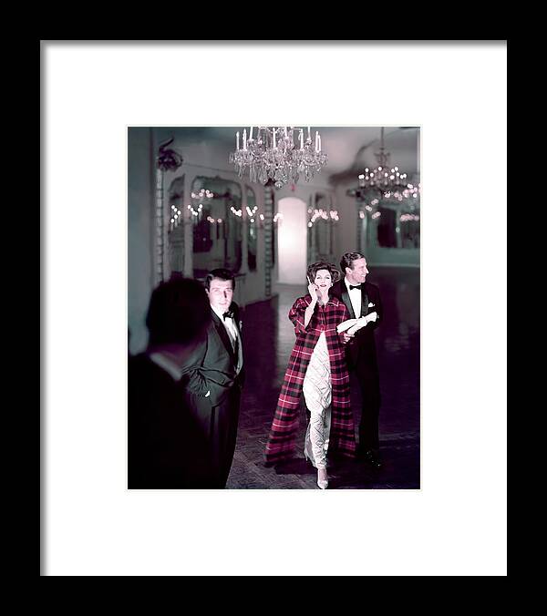 Architecture Framed Print featuring the photograph Model In Silver Dress Escorted By A Gentleman by Henry Clarke