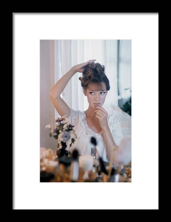 One Person Framed Print featuring the photograph Model Preparing For A Date by Karen Radkai