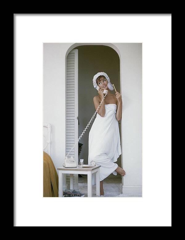 One Person Framed Print featuring the photograph Model Standing In A Bath Towel While Preparing by Karen Radkai