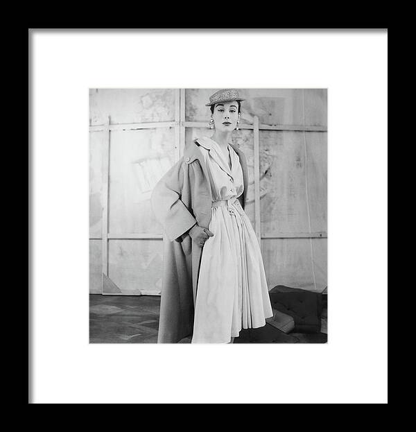 Eye Contact Framed Print featuring the photograph Model Wearing A Givenchy Coat by Henry Clarke