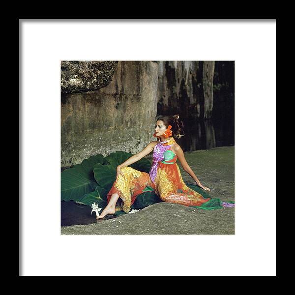 Fashion Framed Print featuring the photograph Model Wearing A Hanae Mori Jumpsuit by Henry Clarke