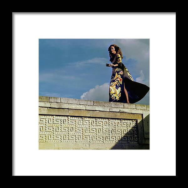 Fashion Framed Print featuring the photograph Model Wearing A Valentino Dress by Henry Clarke