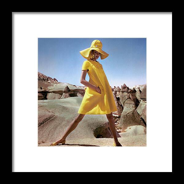 Fashion Framed Print featuring the photograph Model Wearing A Yellow Smock By Hannah Troy by Henry Clarke