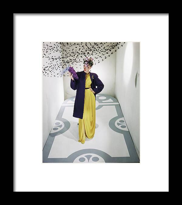 Studio Shot Framed Print featuring the photograph Model Wearing Bergdorf Goodman Dress And Coat by Horst P. Horst