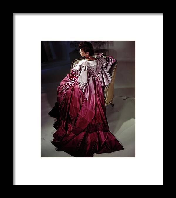 Indoors Framed Print featuring the photograph Model Wearing Purple Coat By Adrian by Horst P. Horst