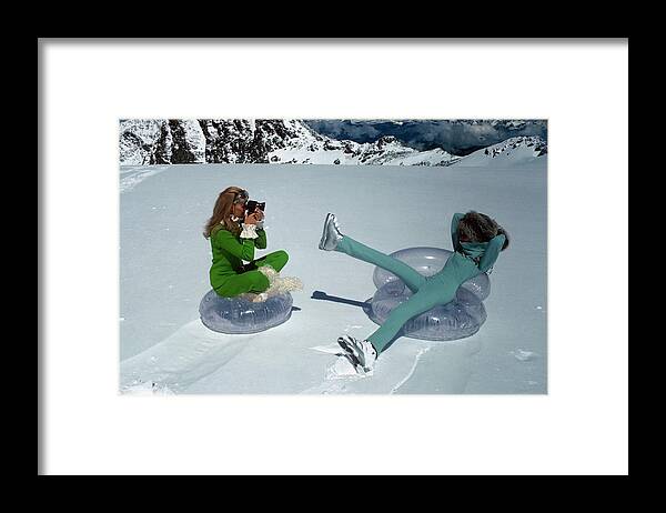 Fashion Framed Print featuring the photograph Models On Plastic Chairs With Snow In Switzerland by Arnaud de Rosnay