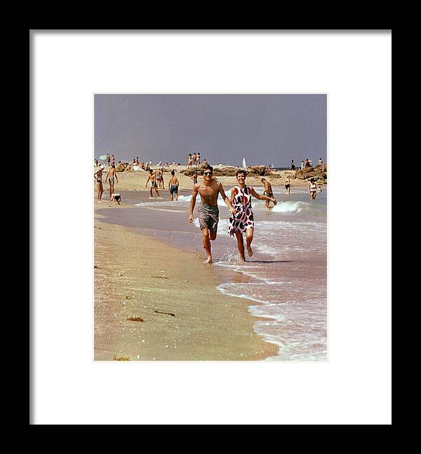 Water Framed Print featuring the photograph Models Running On A Beach by William Connors
