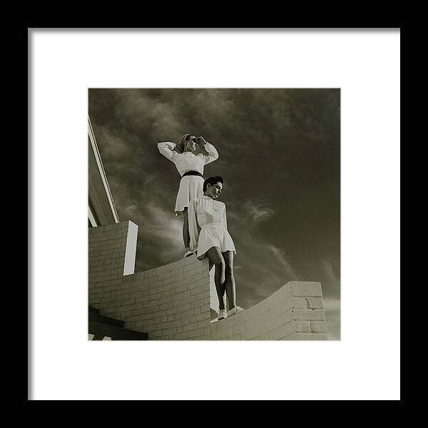 Exterior Framed Print featuring the photograph Models Standing On A Brick Wall by Toni Frissell