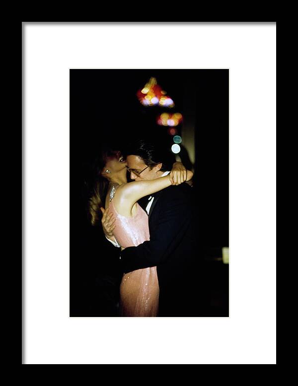 Fashion Framed Print featuring the photograph Models Wearing Evening Wear Embracing by Arthur Elgort