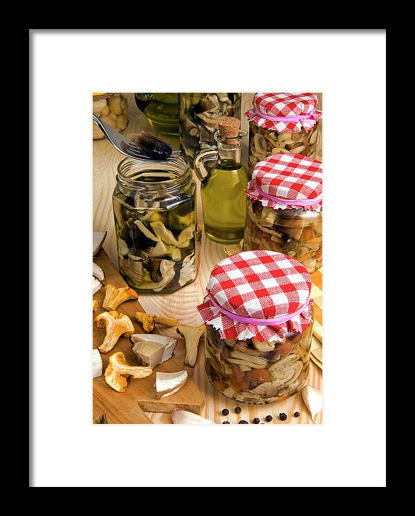 Assortment Framed Print featuring the photograph Mushrooms In Jar Preserved In Olive Oil by Nico Tondini