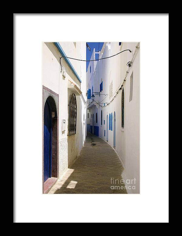 Narrow Backstreet Of Asilah Framed Print featuring the photograph Narrow Backstreet in the Medina of Asilah on Northwest tip of Atlantic Coast of Morocco by PIXELS XPOSED Ralph A Ledergerber Photography