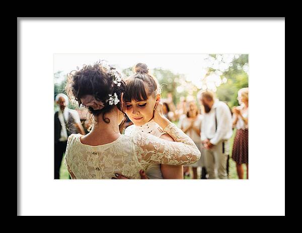Mid Adult Women Framed Print featuring the photograph Newlywed lesbian couple dancing by Hinterhaus Productions
