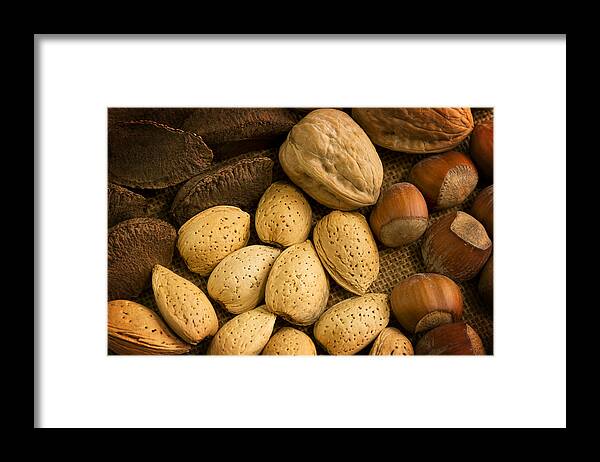 Nuts Framed Print featuring the photograph Nuts Aglow by Mark McKinney