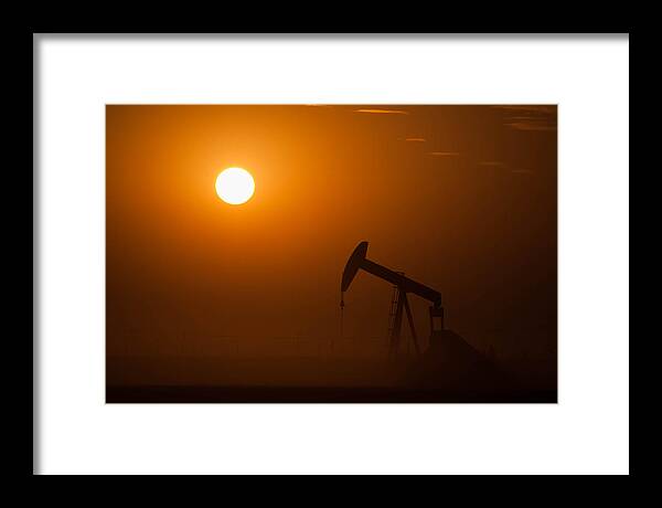 Oil Rig Framed Print featuring the photograph Oil Rig Pumping at Sunset by Connie Cooper-Edwards