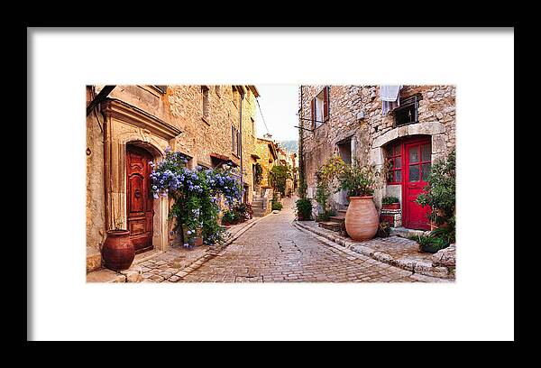 Built Structure Framed Print featuring the photograph Old French village houses and cobblestone street by Paparazzit