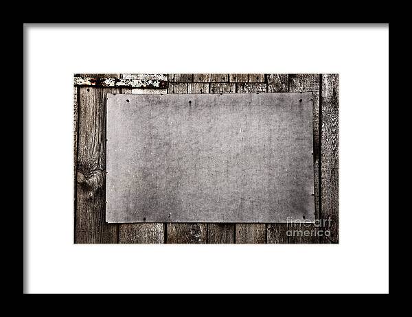 Grunge Framed Print featuring the photograph Old grunge plywood board on a wooden wall by Michal Bednarek